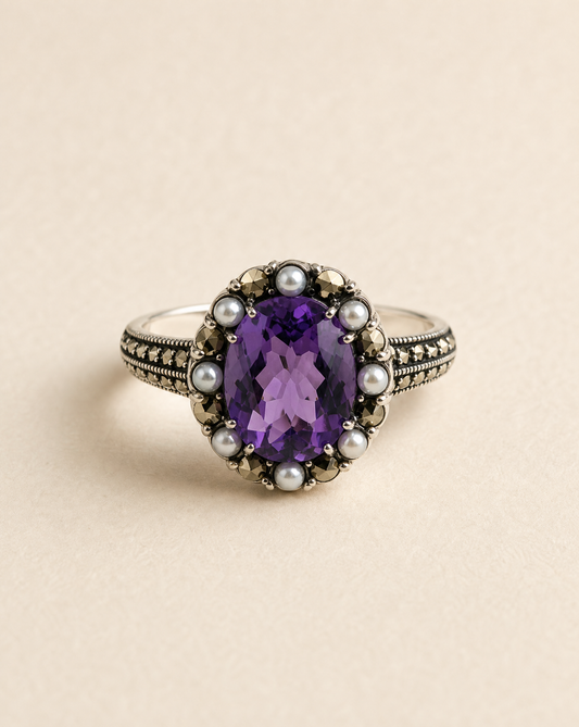 Brilliance ring, large oval amethyst in a seed pearl and marcasite halo on an ornate 925 silver band, Victorian statement ring