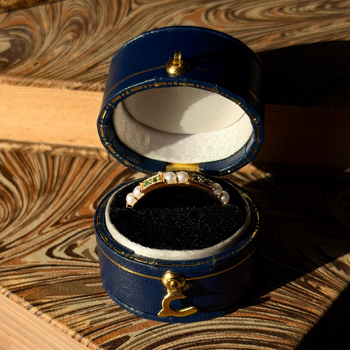 Emerald Gaze Ring, a green gemstone and pearl band in a navy vintage ring box, antique-inspired jewellery