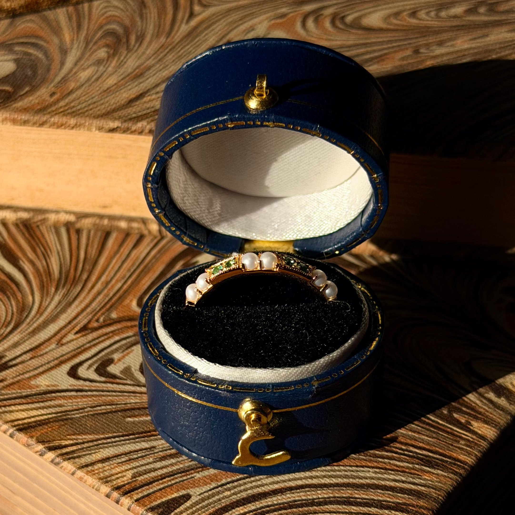 Emerald Gaze Ring, a green gemstone and pearl band in a navy vintage ring box, antique-inspired jewellery